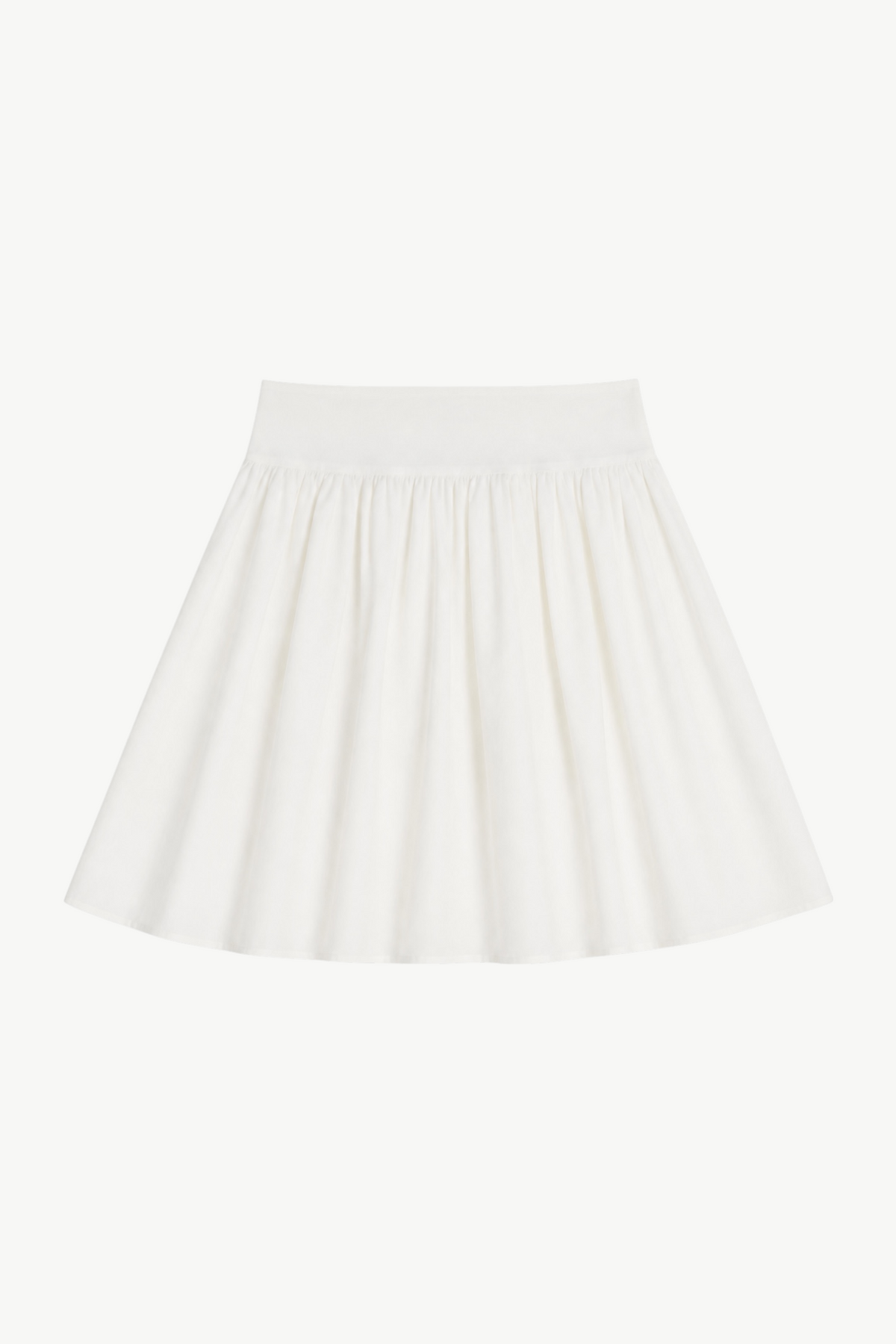 Minimalist flat lay of the MOCHA Delphine skirt, showcasing the airy, soft organic cotton texture and its pure, clean silhouette.