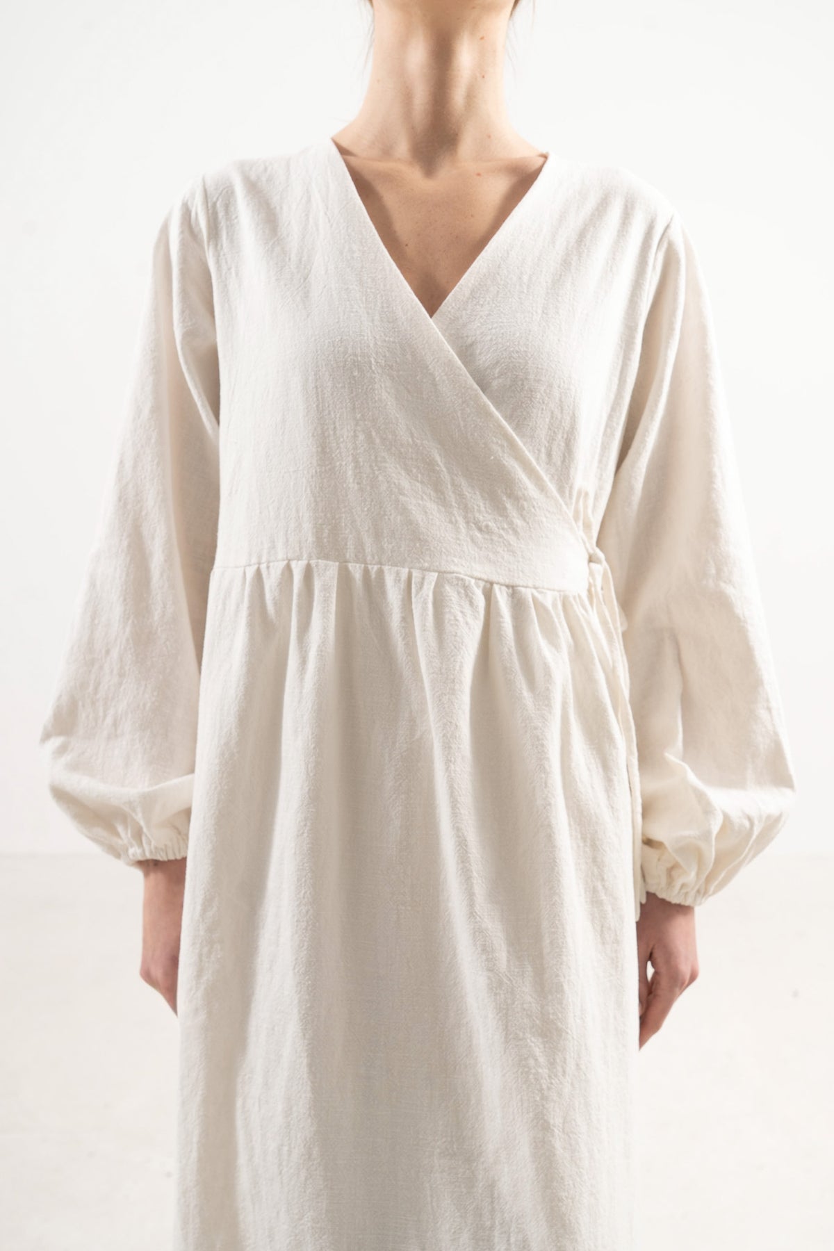Close-up of the adjustable straps and cotton fabric on the Mocha Amadea dress