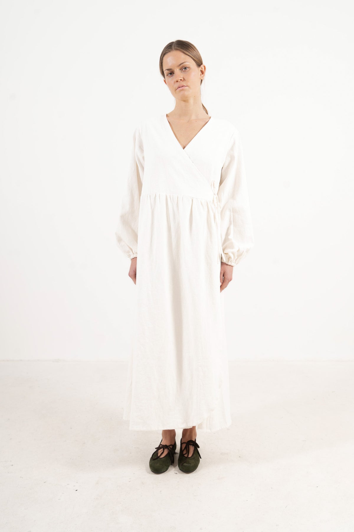 Woman wearing the Mocha Amadea dress in cotton, front view