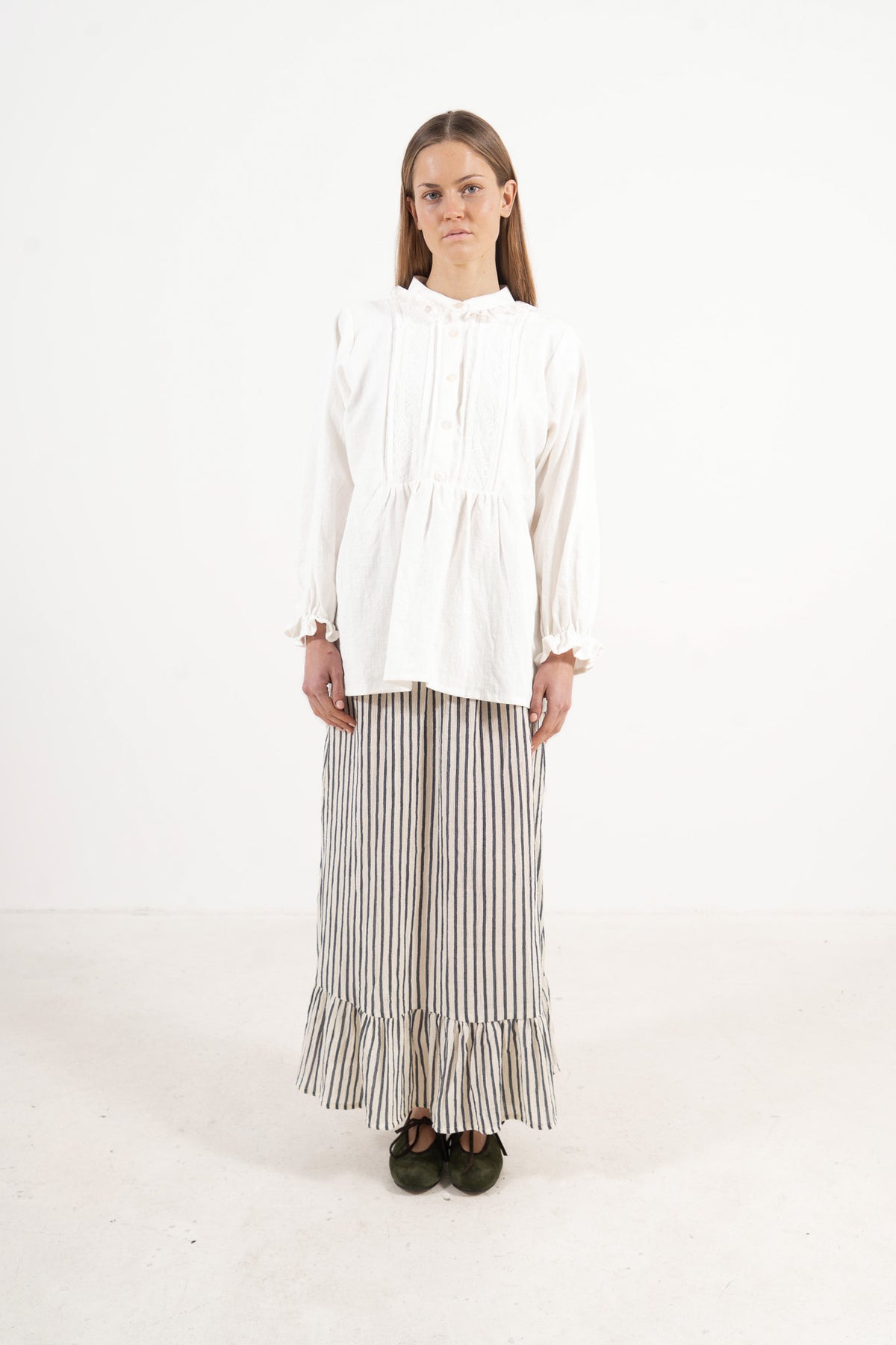 Front view studio portrait featuring a model in the Amélie Blouse by MOCHA, wrapping you in effortless elegance and gentle lightness.