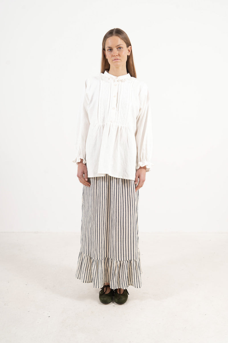 Front view studio portrait featuring a model in the Amélie Blouse by MOCHA, wrapping you in effortless elegance and gentle lightness.