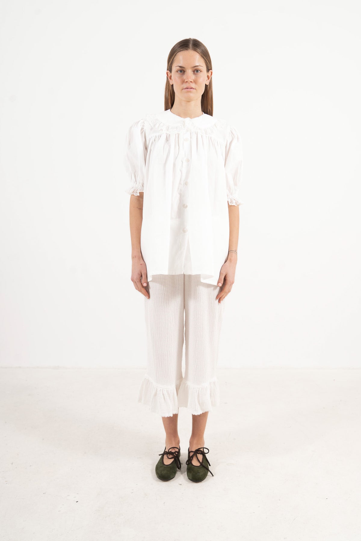 Front view studio portrait featuring a model in the Amour Blouse by MOCHA, wrapping you in effortless elegance and gentle lightness.