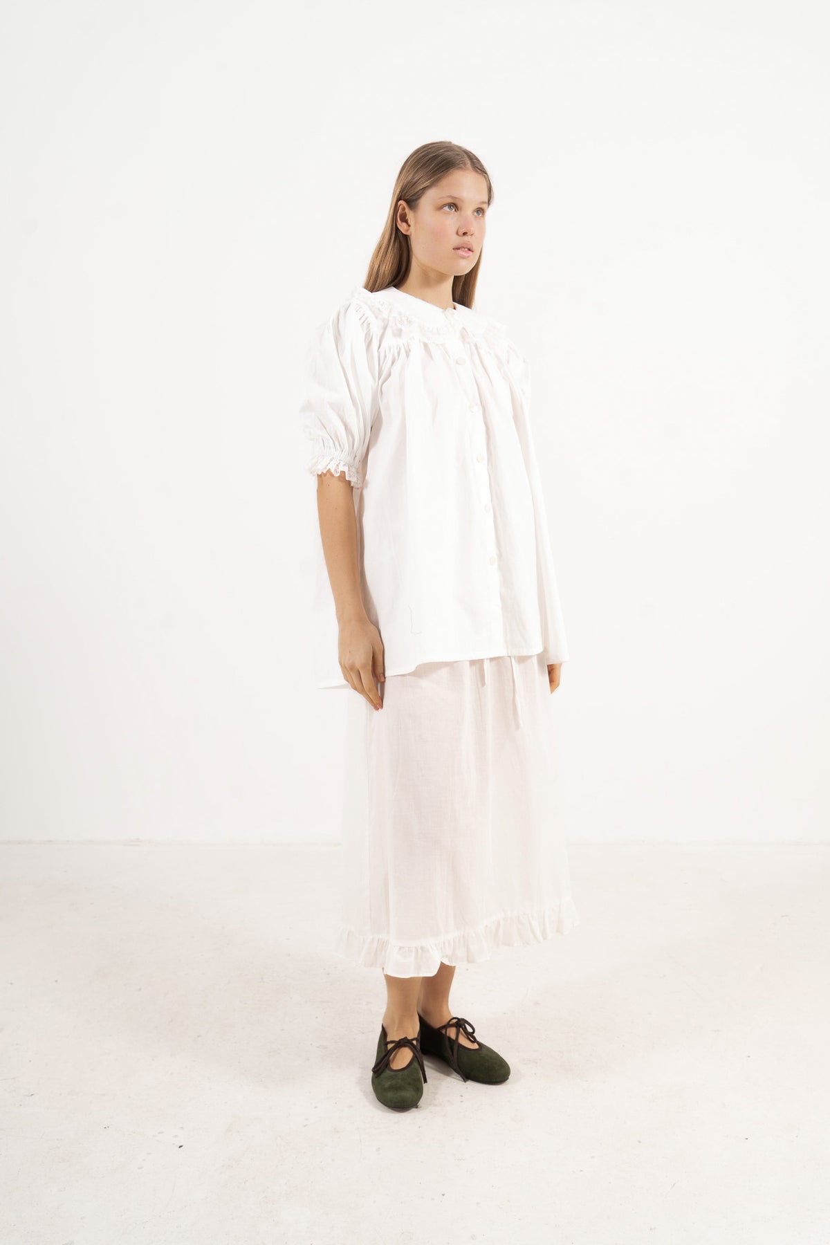 Front view studio portrait featuring a model in the Amour Blouse by MOCHA, wrapping you in effortless elegance and gentle lightness.