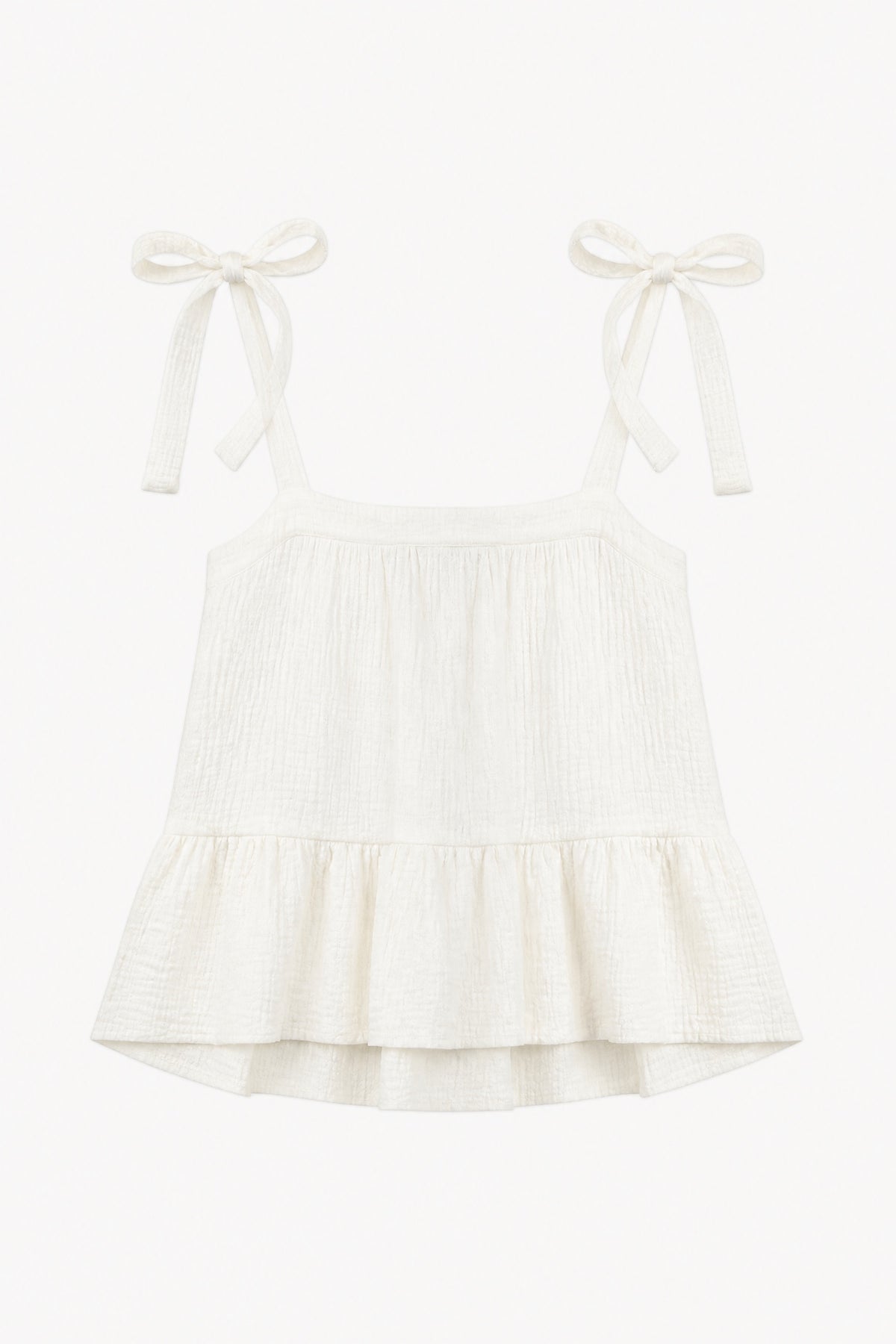 Minimalist flat lay of the MOCHA Belle top, highlighting the pure white organic cotton texture and clean, delicate silhouette.