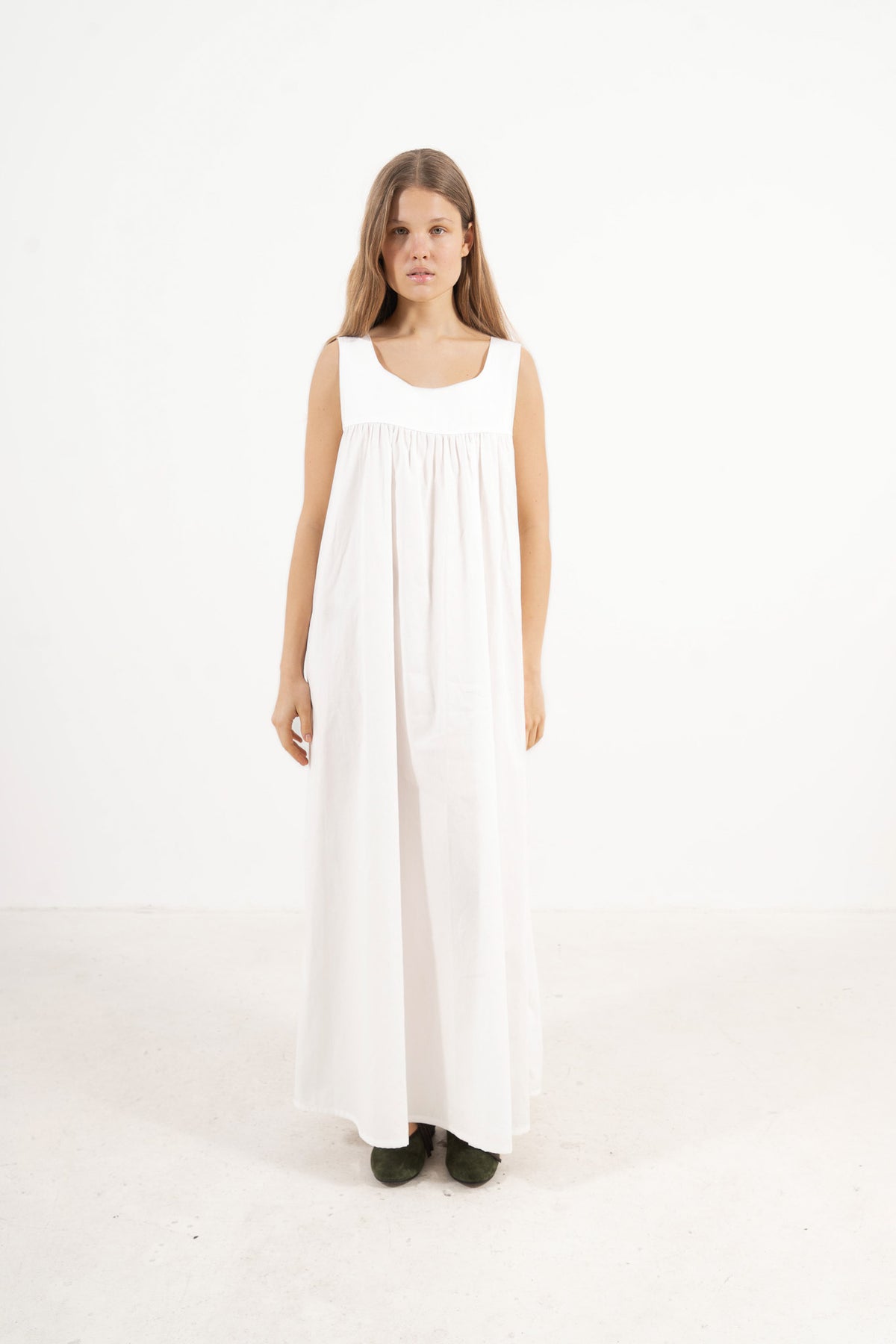 Front view studio portrait featuring a model in the Céleste Dress by MOCHA, capturing its effortless elegance and soft world of lightness.