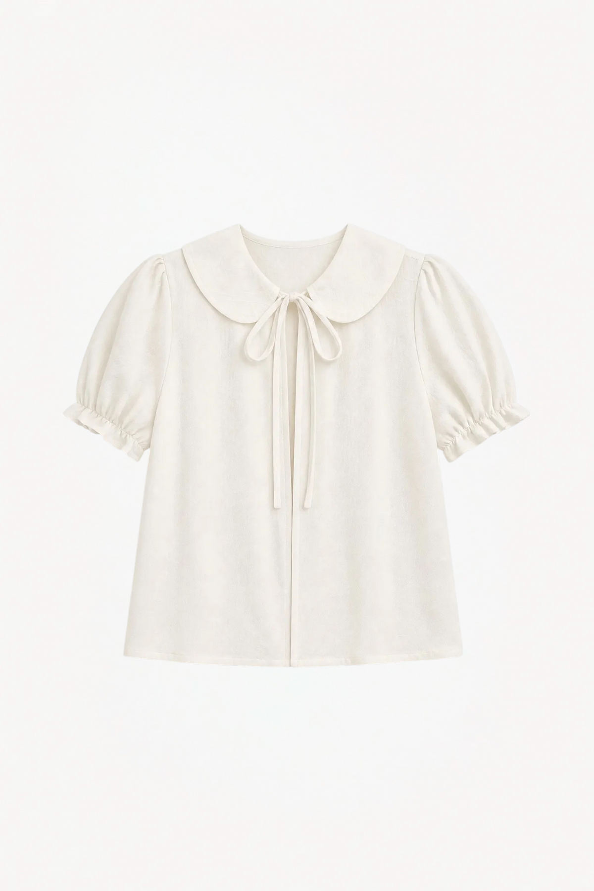 Minimalist flat lay layout of the MOCHA Chérie blouse, highlighting the soft white cotton fabric and romantic, sweet silhouette.