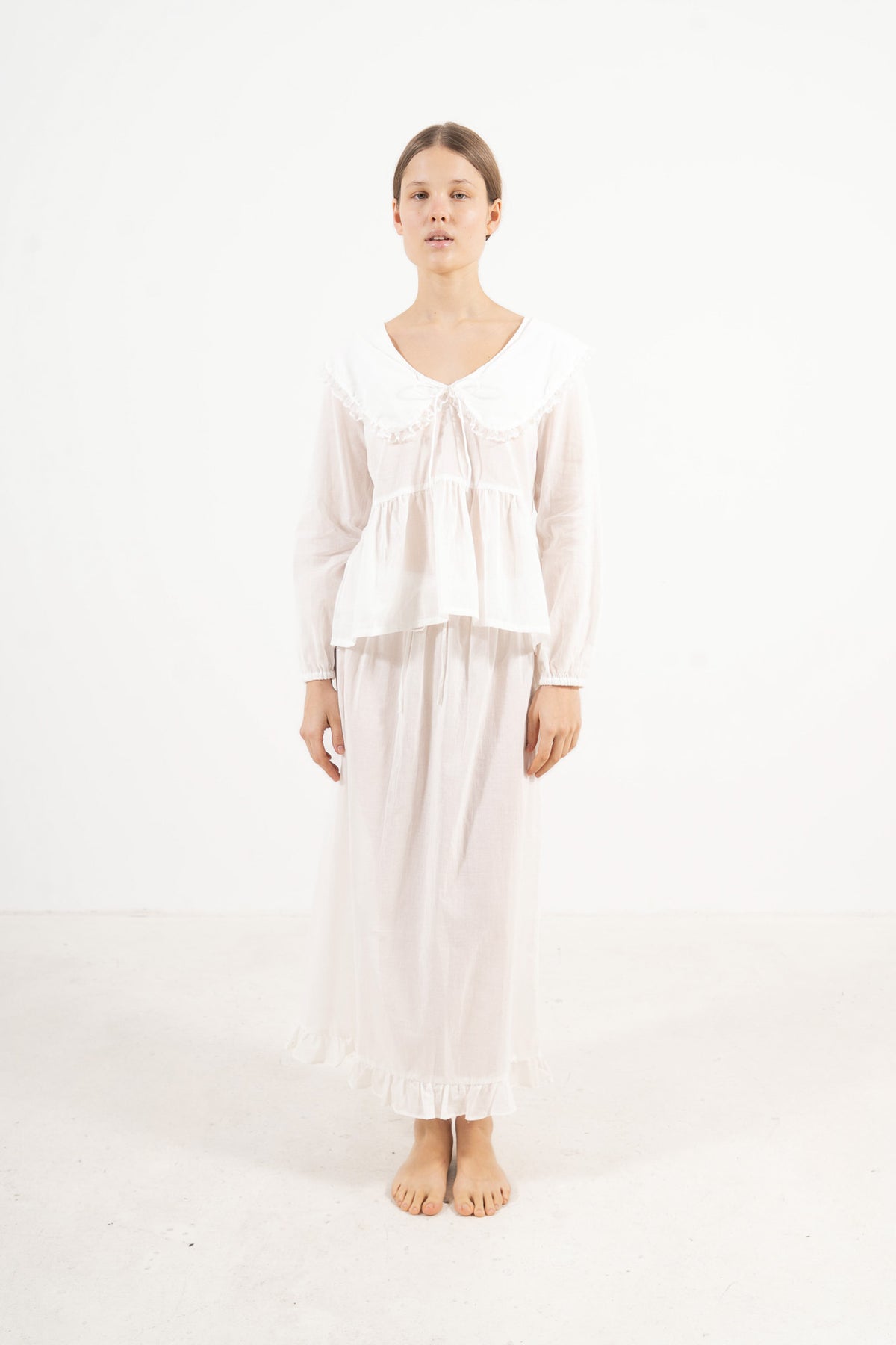 Front view studio portrait featuring a model in the Élodie set by MOCHA, embodying understated femininity and quiet ease.