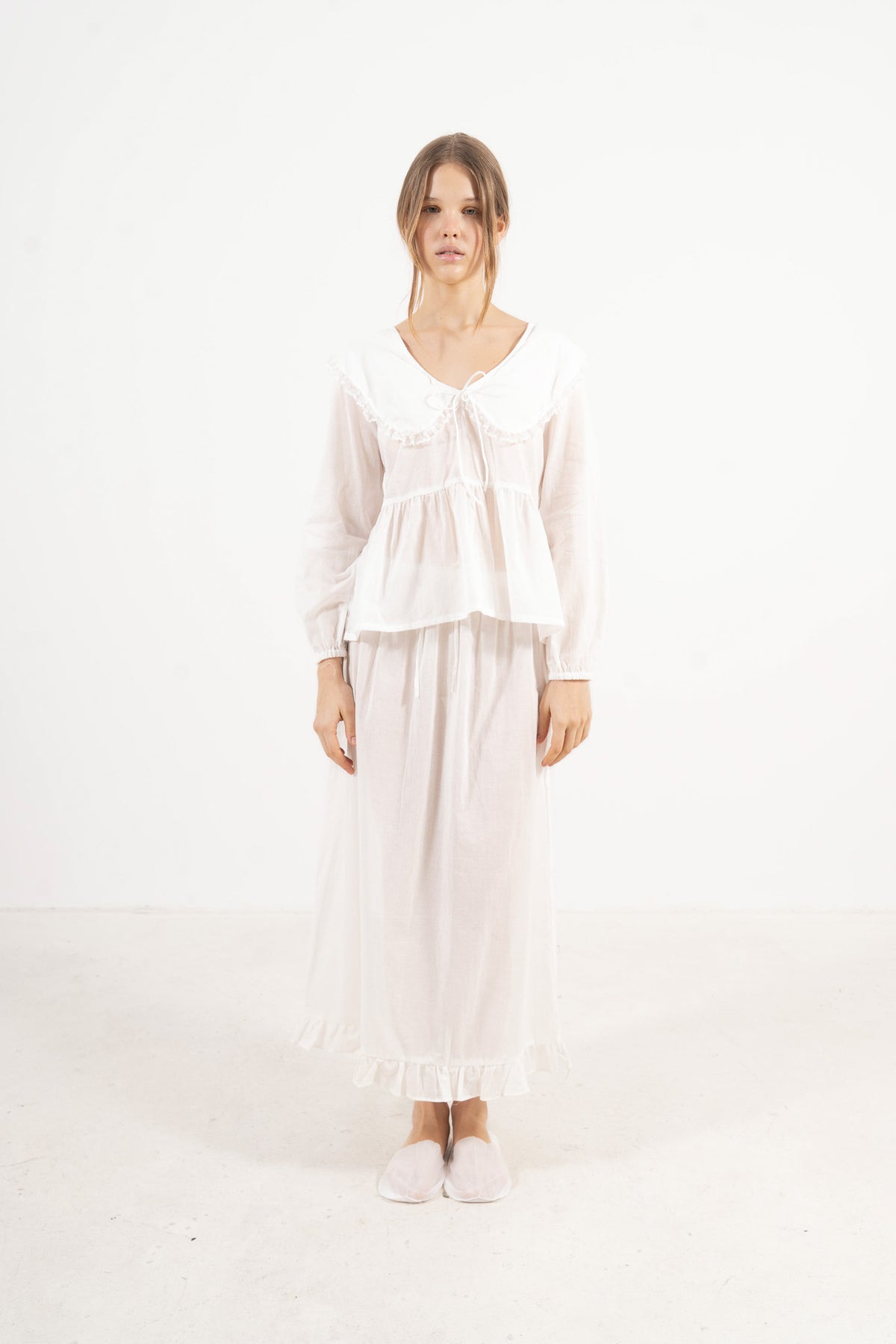 Front view studio portrait featuring a model in the Élodie set by MOCHA, embodying understated femininity and quiet ease.