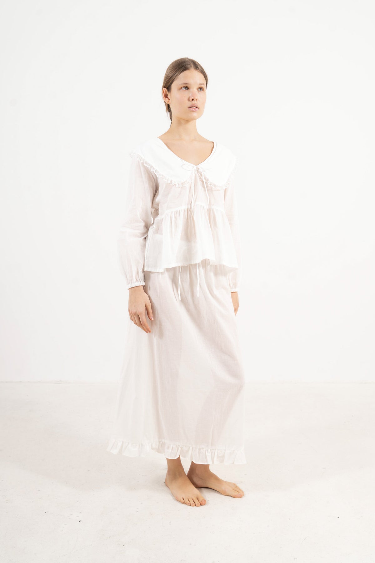 Side lookbook capture of the premium cotton lounge set, showcasing how the weightless fabric drapes beautifully and effortlessly.
