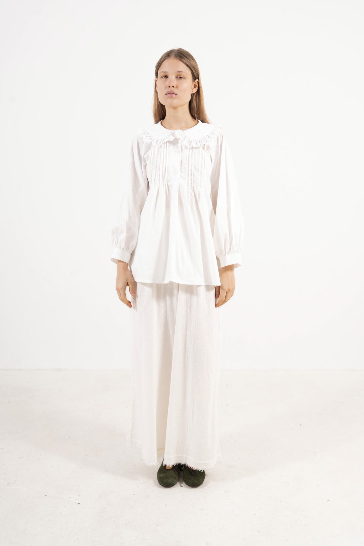 Front view studio portrait featuring a model in the Juliette Blouse by MOCHA, capturing its quiet elegance, soft drape, and effortless lightness.