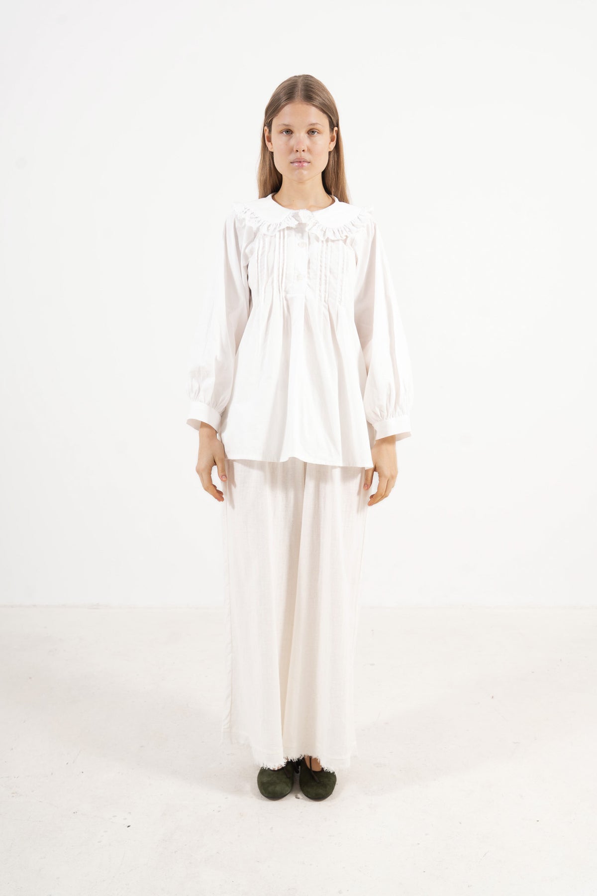 Front view studio portrait featuring a model in the Juliette Blouse by MOCHA, capturing its quiet elegance, soft drape, and effortless lightness.