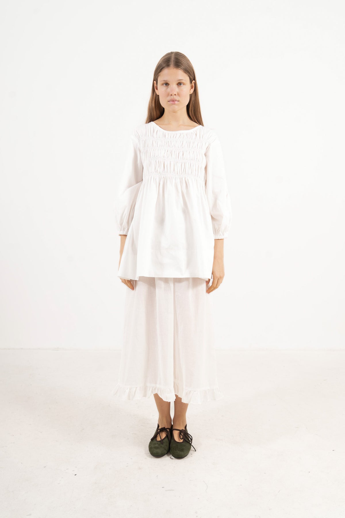 Front view studio portrait featuring a model in the La Cour Blouse by MOCHA, capturing its aristocratic grace, soft drape, and understated opulence.