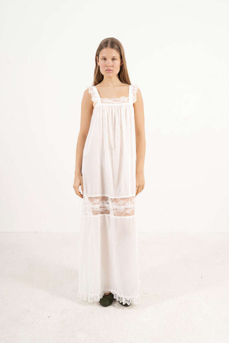 Front view studio portrait featuring a model in the La Nuit Dress by MOCHA, capturing its understated femininity and soft world of quiet ease.