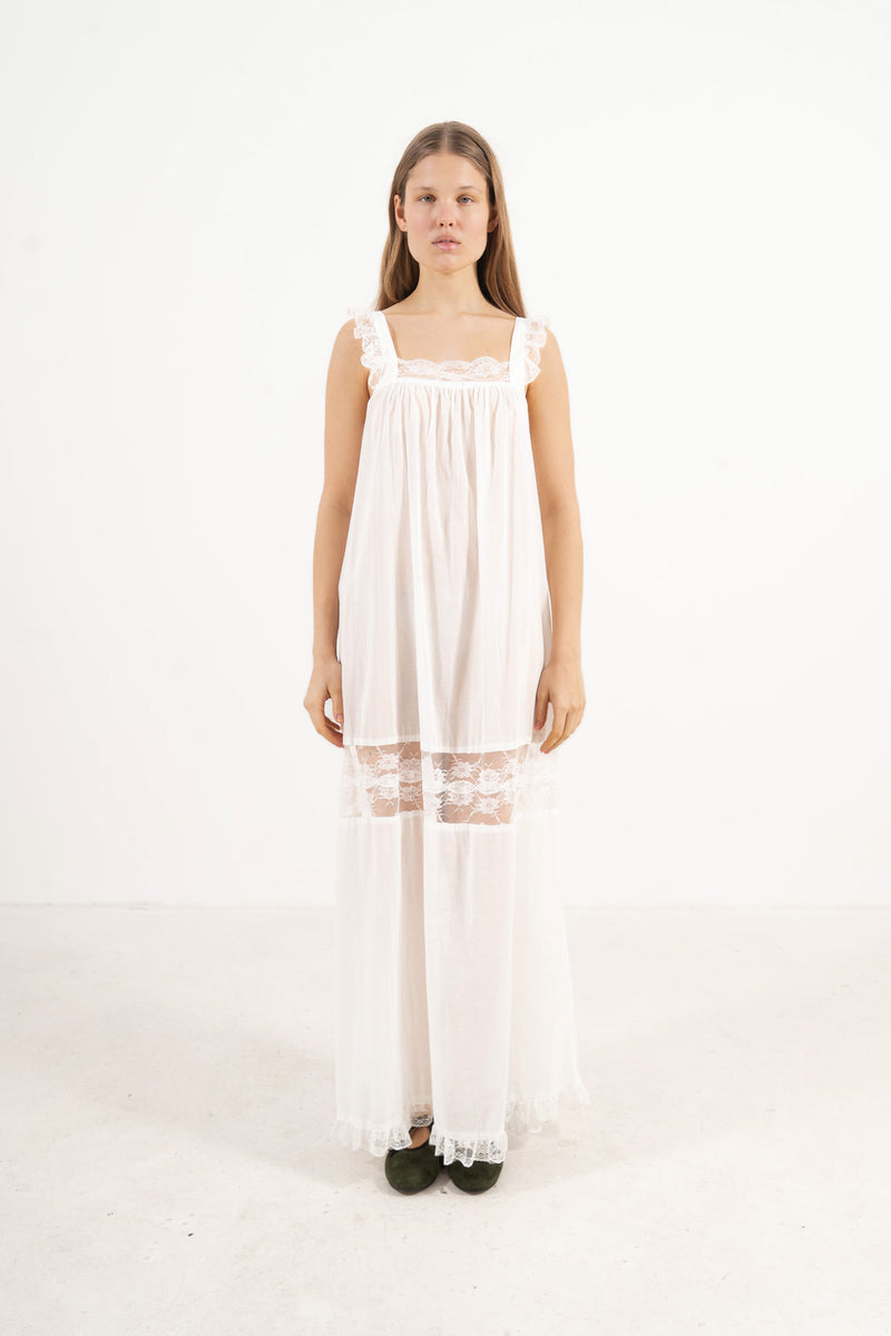 Front view studio portrait featuring a model in the La Nuit Dress by MOCHA, capturing its understated femininity and soft world of quiet ease.