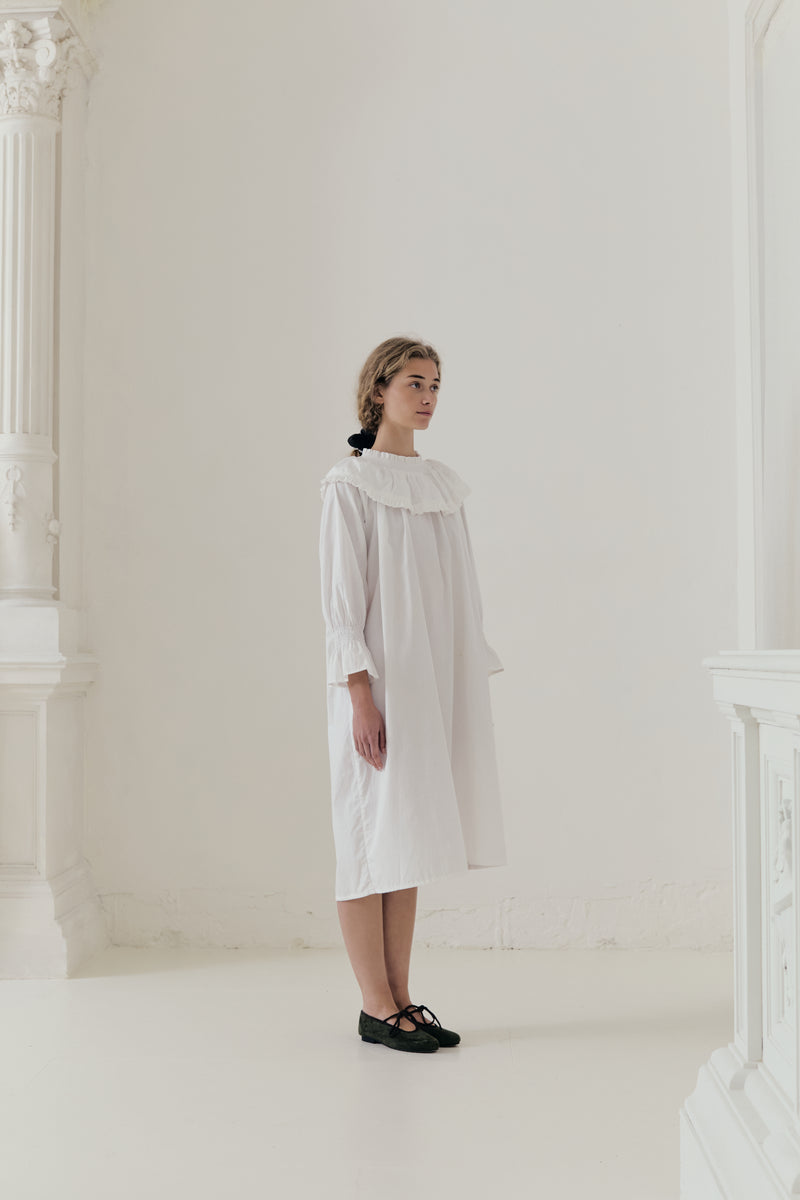 Cinematic editorial lookbook image featuring La Robe Lucienne, radiating a sense of refined heritage and understated luxury.