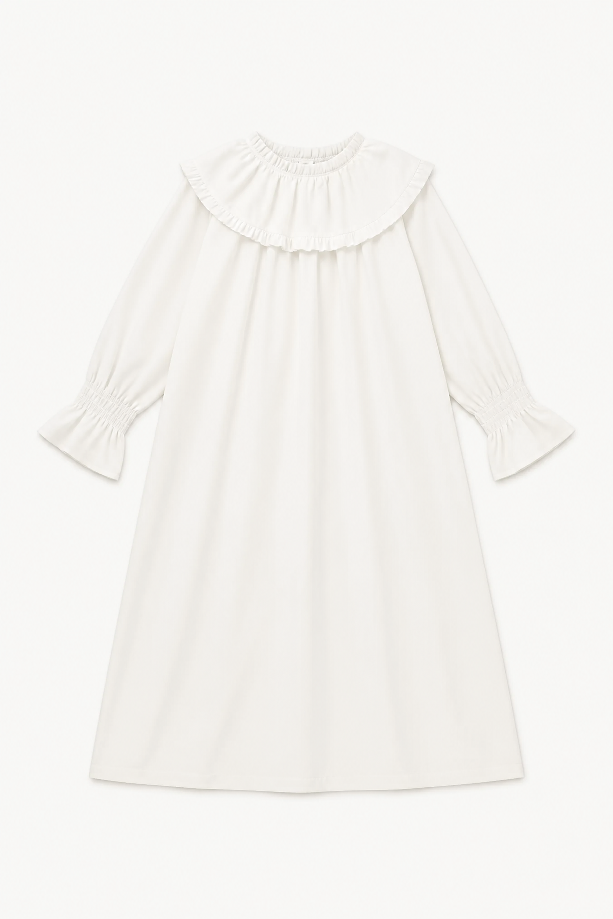Minimalist flat lay of MOCHA La Robe Lucienne, showcasing the soft organic cotton texture and its pure, flowing silhouette.