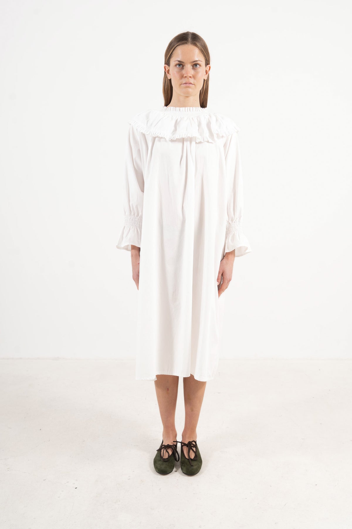 Front view studio portrait featuring a model in La Robe Lucienne by MOCHA, capturing its majestic romantic silhouette and special collar details.
