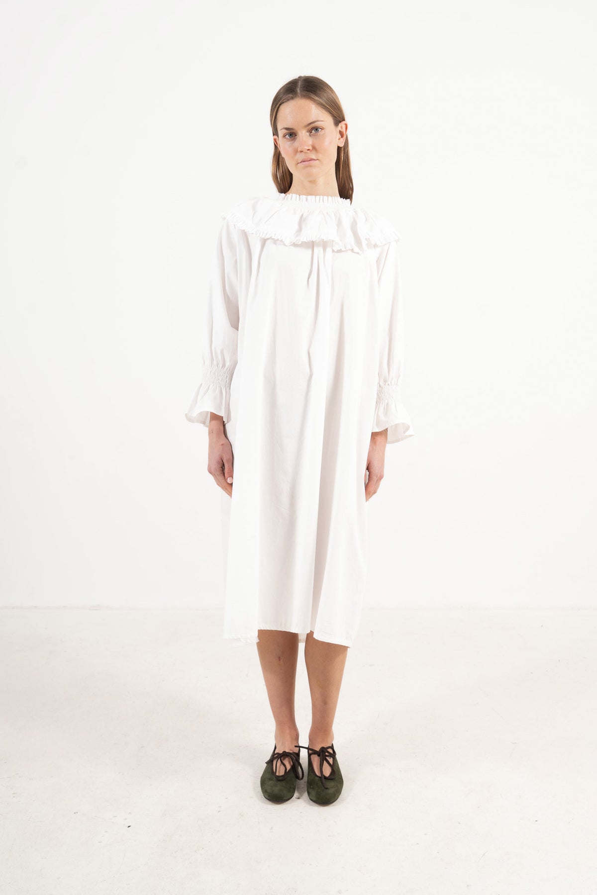 Front view studio portrait featuring a model in La Robe Lucienne by MOCHA, capturing its majestic romantic silhouette and special collar details.
