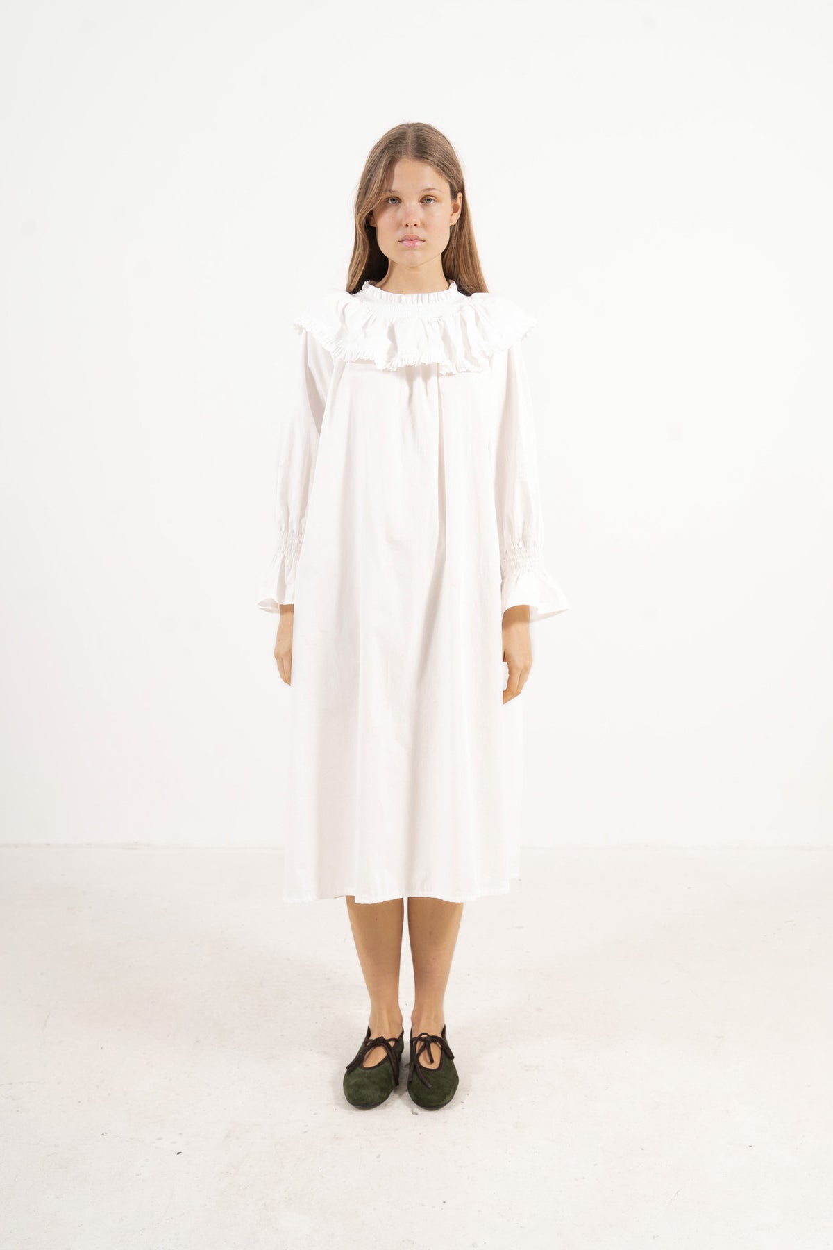 Front view studio portrait featuring a model in La Robe Lucienne by MOCHA, capturing its majestic romantic silhouette and special collar details.