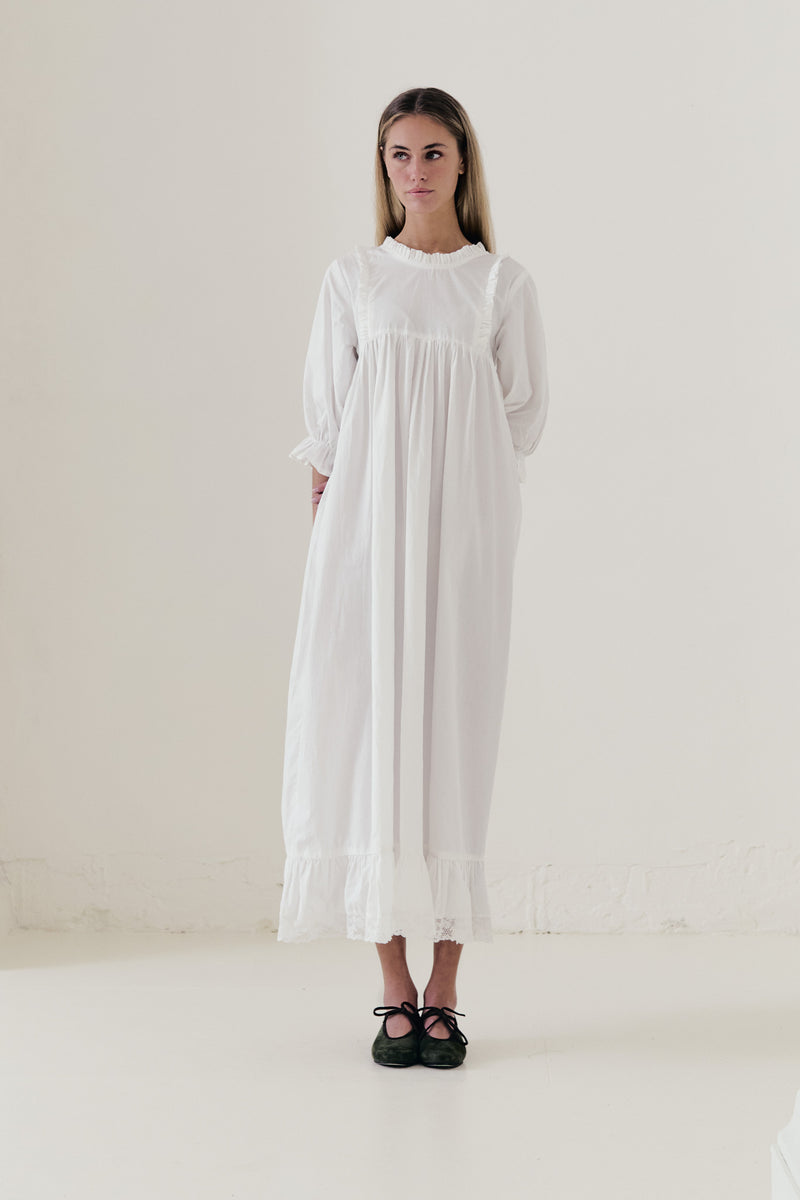 Front view studio portrait featuring a model in La Robe Noblesse by MOCHA, embodying aristocratic grace and understated opulence.