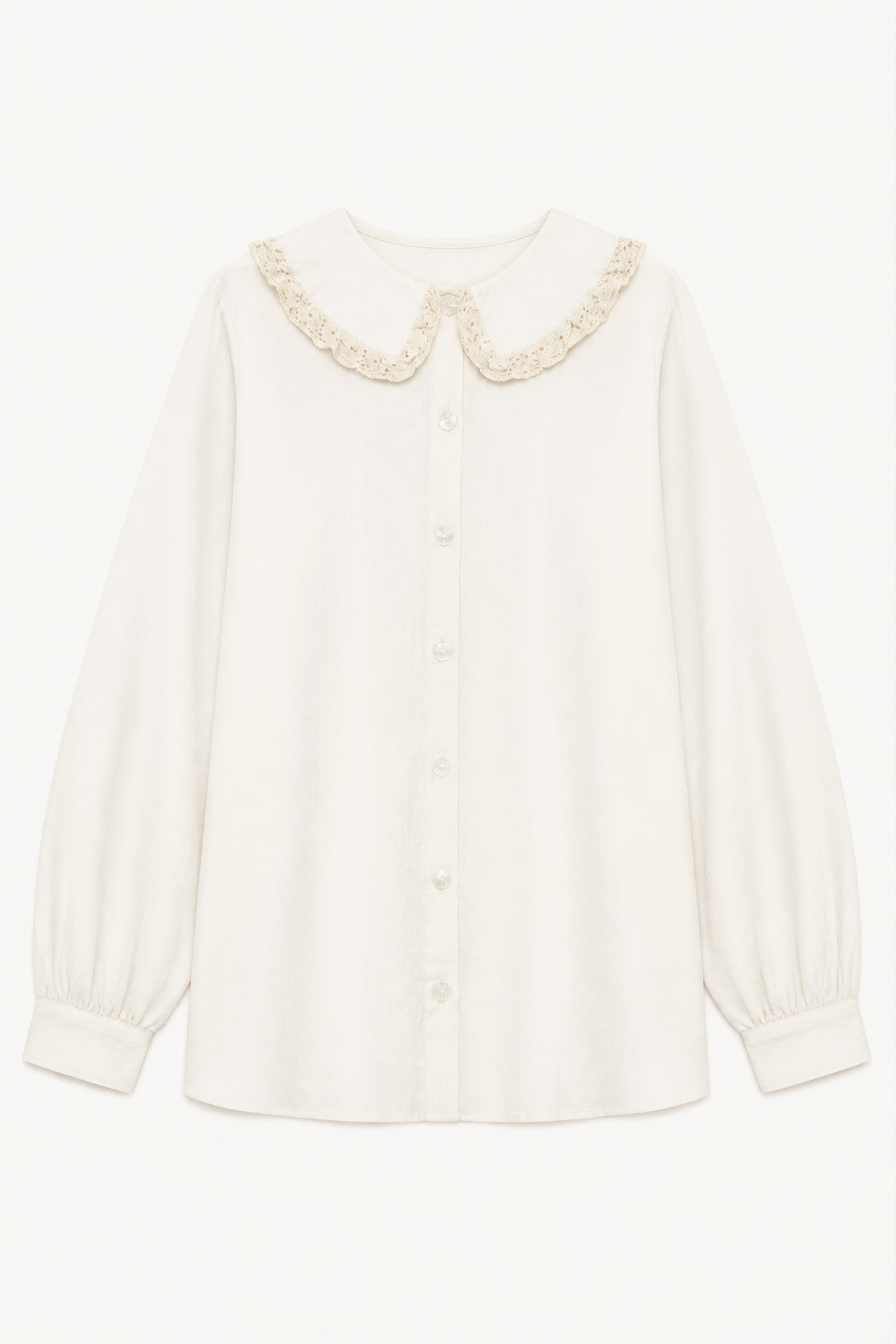Minimalist flat lay layout of the MOCHA Le Souffle blouse, highlighting its soft fabric texture and clean, relaxed silhouette.