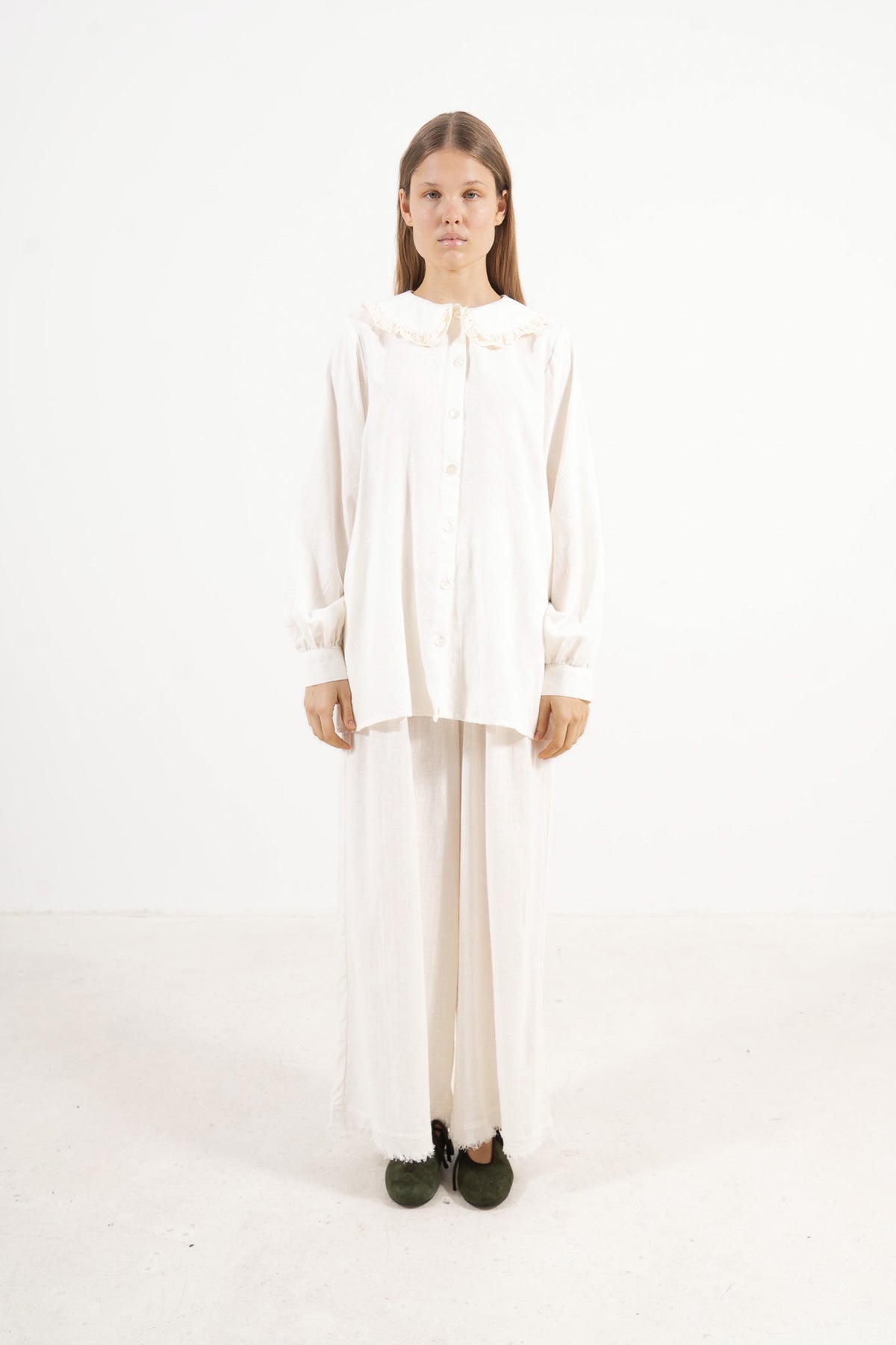 Front view studio portrait featuring a model in the Le Souffle Blouse by MOCHA, wrapping you in effortless elegance and gentle lightness.