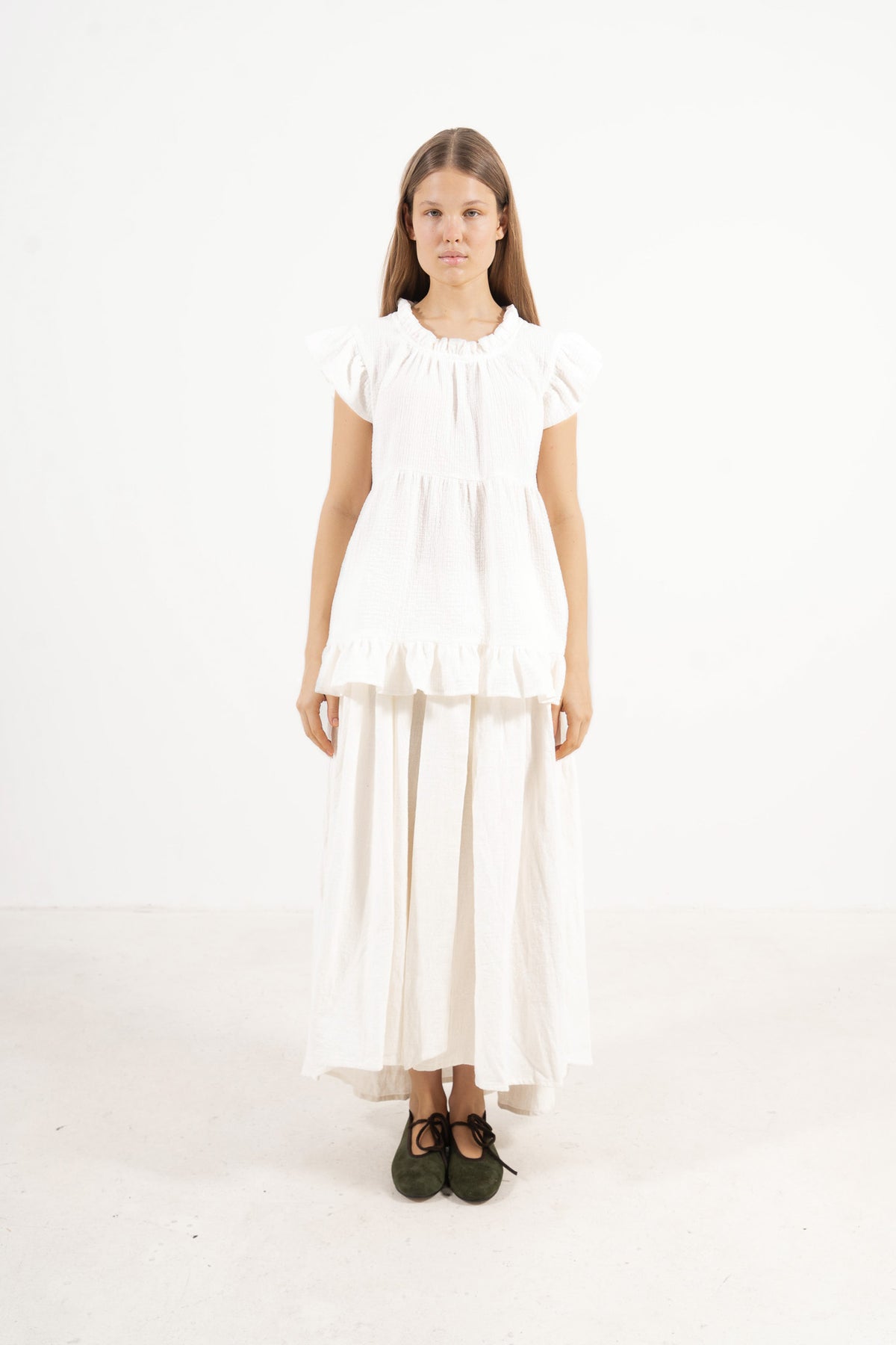 Front view studio portrait featuring a model in Le Top Céline by MOCHA, capturing its effortless elegance and beautifully ruffled details.