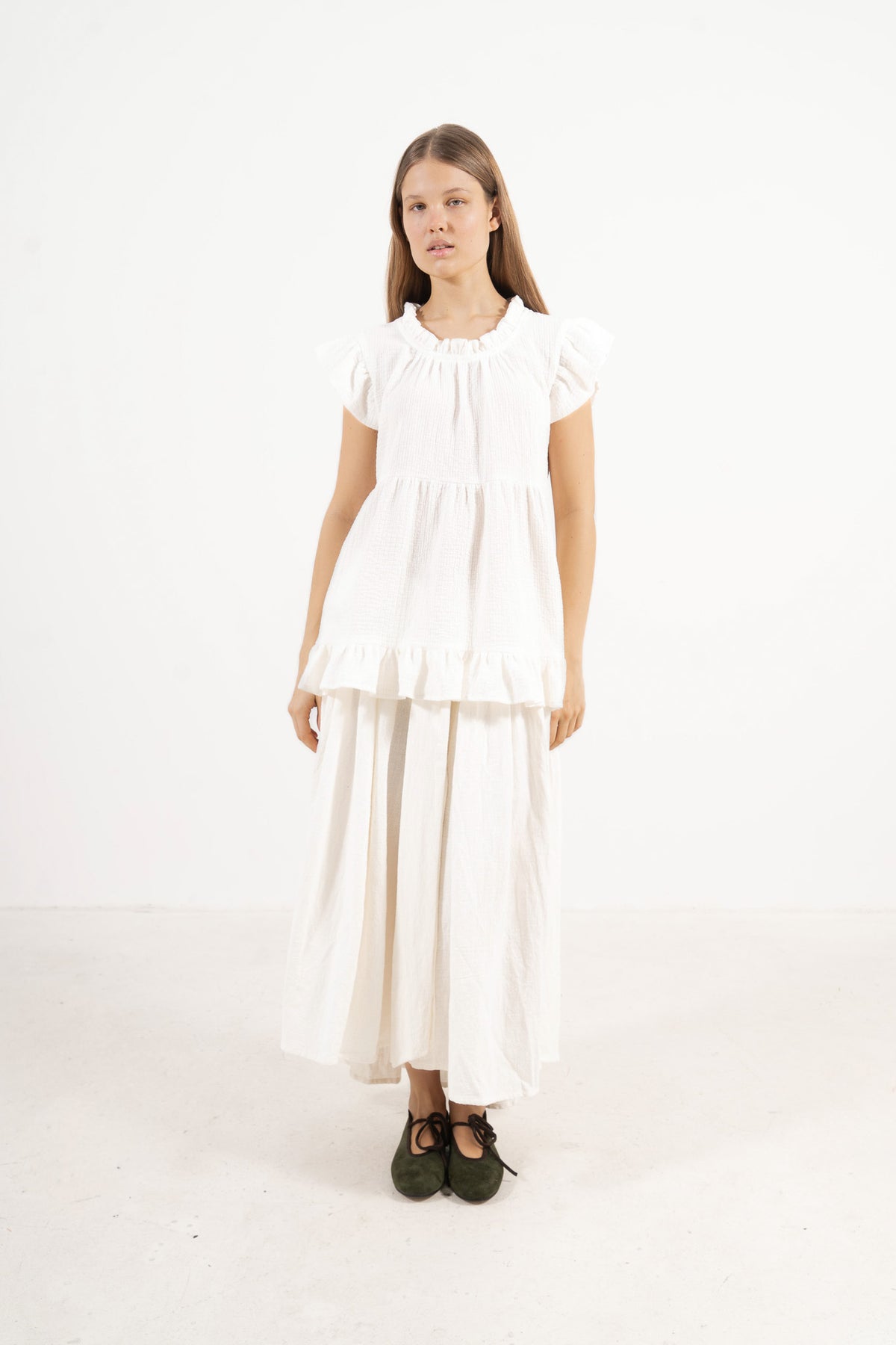 Front view studio portrait featuring a model in Le Top Céline by MOCHA, capturing its effortless elegance and beautifully ruffled details.