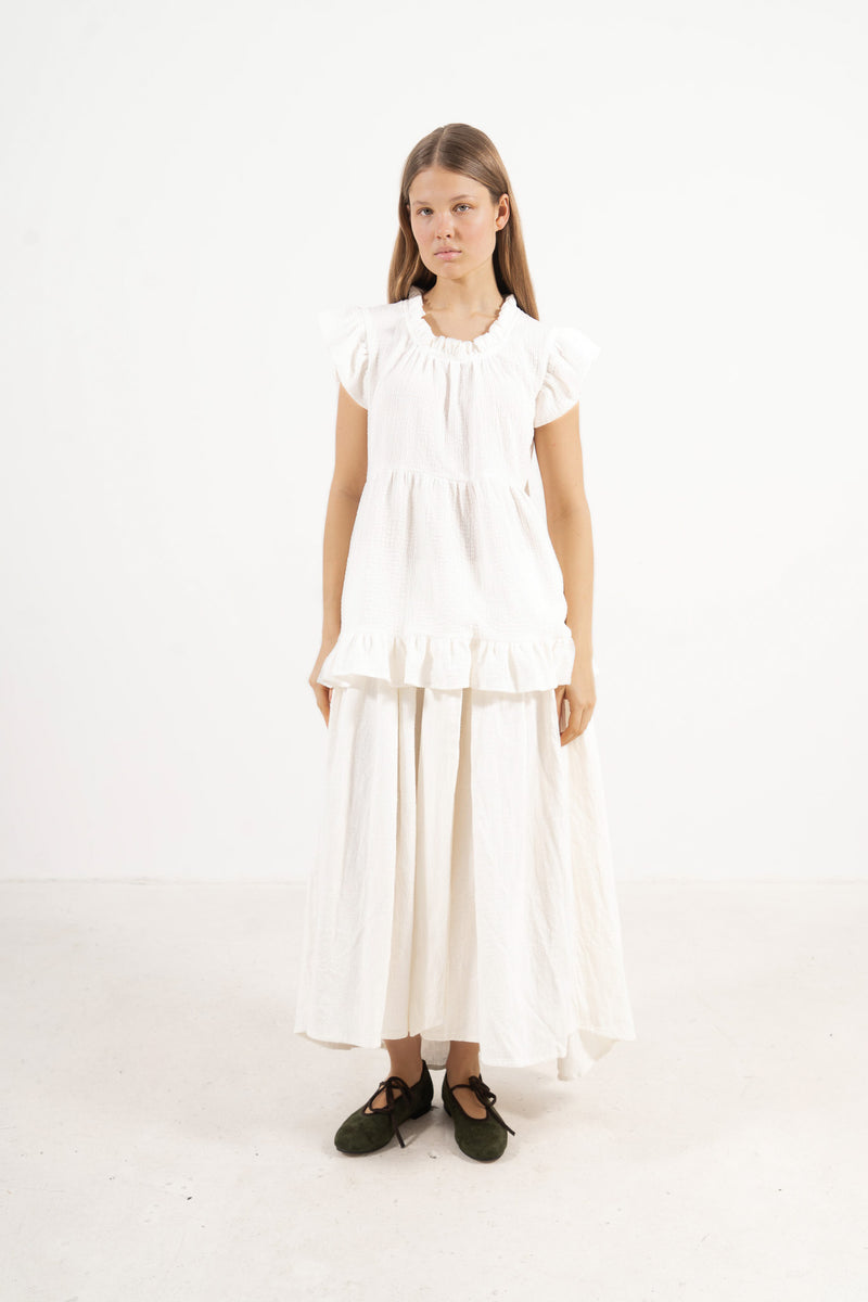 Front view studio portrait featuring a model in Le Top Céline by MOCHA, capturing its effortless elegance and beautifully ruffled details.