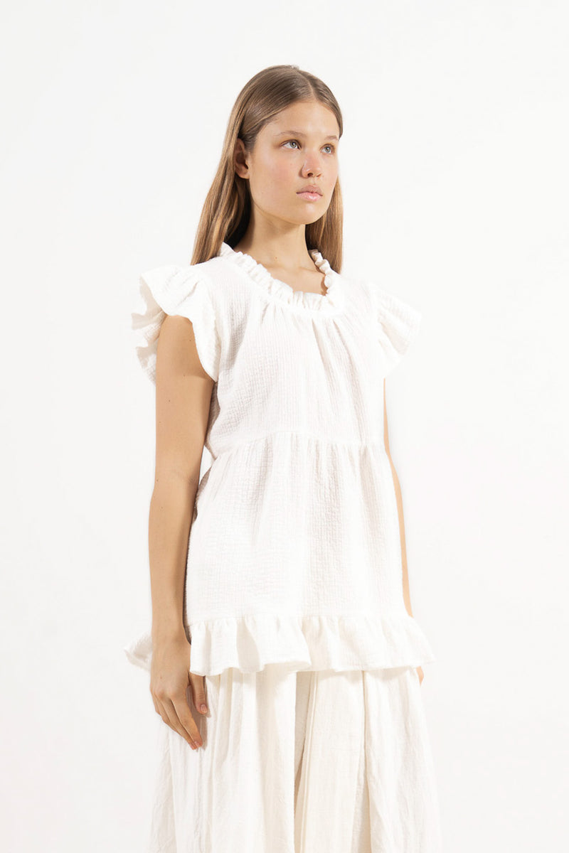 Side lookbook capture of the soft cotton top, emphasizing the beautiful, lightweight drape inspired by air, movement, and gentle days