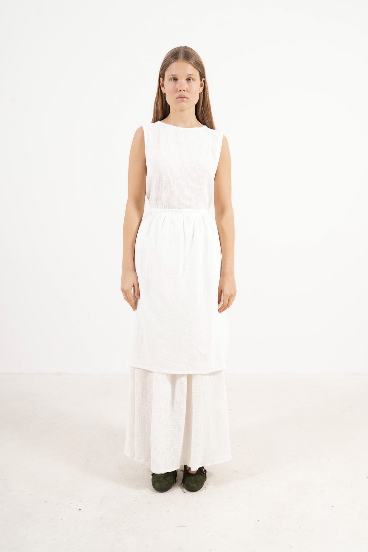 MOCHA Nuage dress in a front view studio shot, displaying its elegant silhouette and clean lines against a white background.