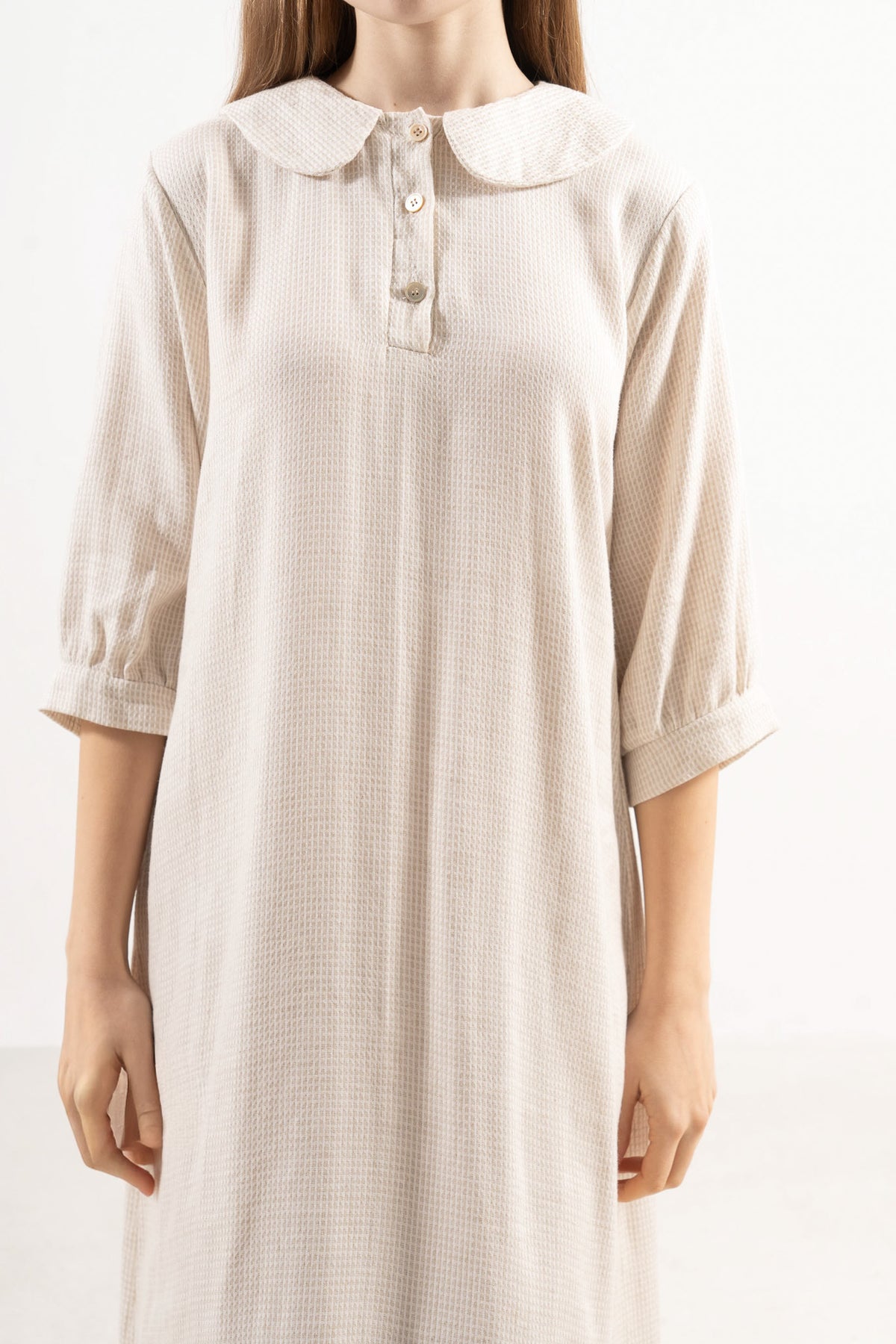 Detailed close-up focusing on the premium, breathable 100% cotton fabric and weightless texture of the MOCHA Mielle Dress.