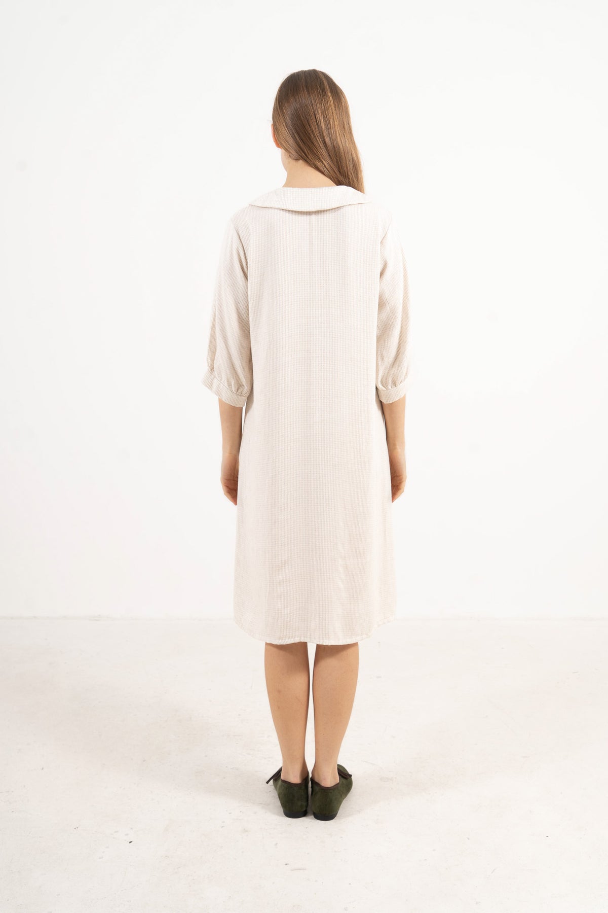 Back silhouette of the timeless Mielle Sleeve Dress by MOCHA, showcasing the relaxed drape and quiet ease of the midi loungewear cut.