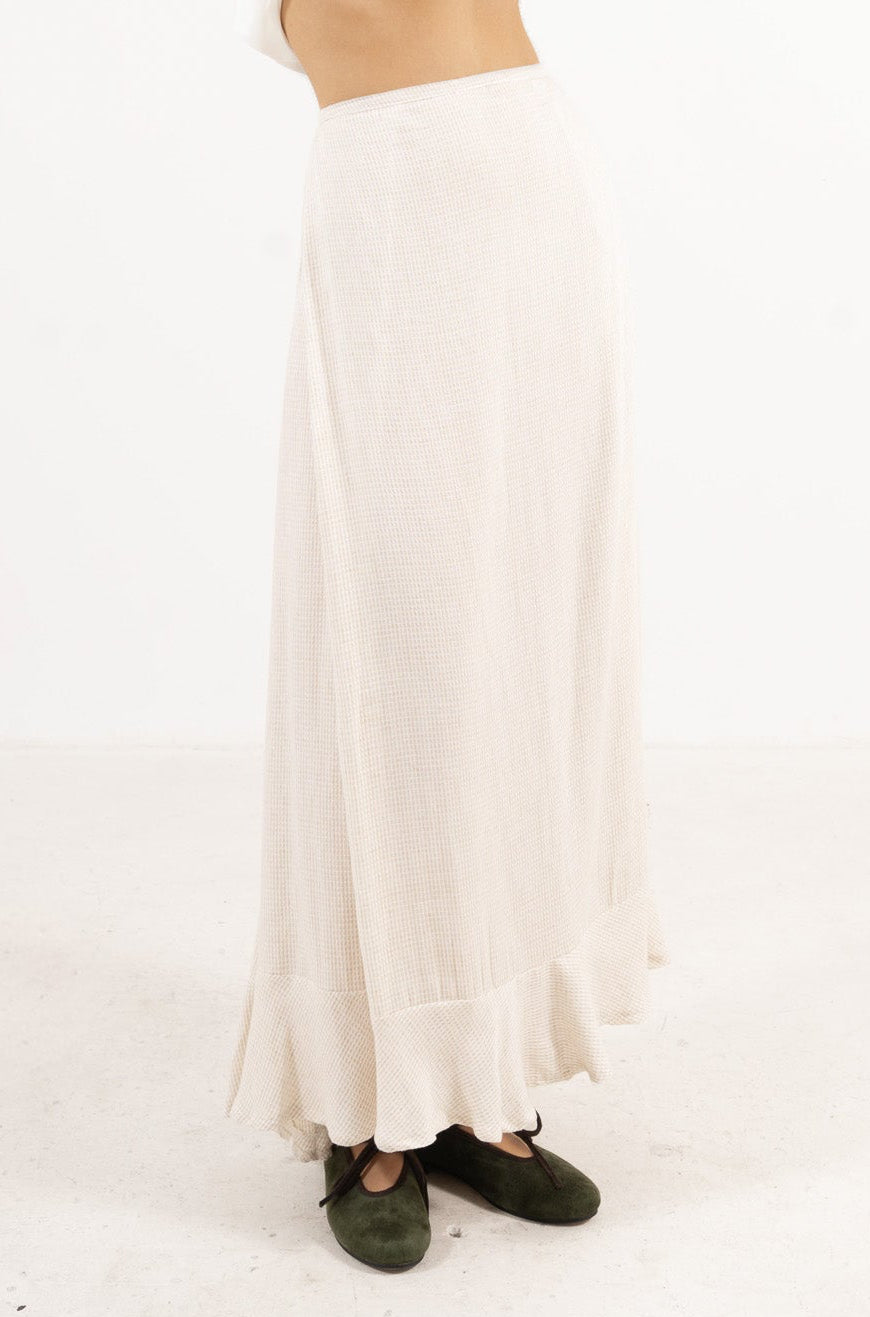 Side profile view of the long Mielle Skirt, capturing the generous length, layered ruffles, and soft lightness unique to MOCHA.