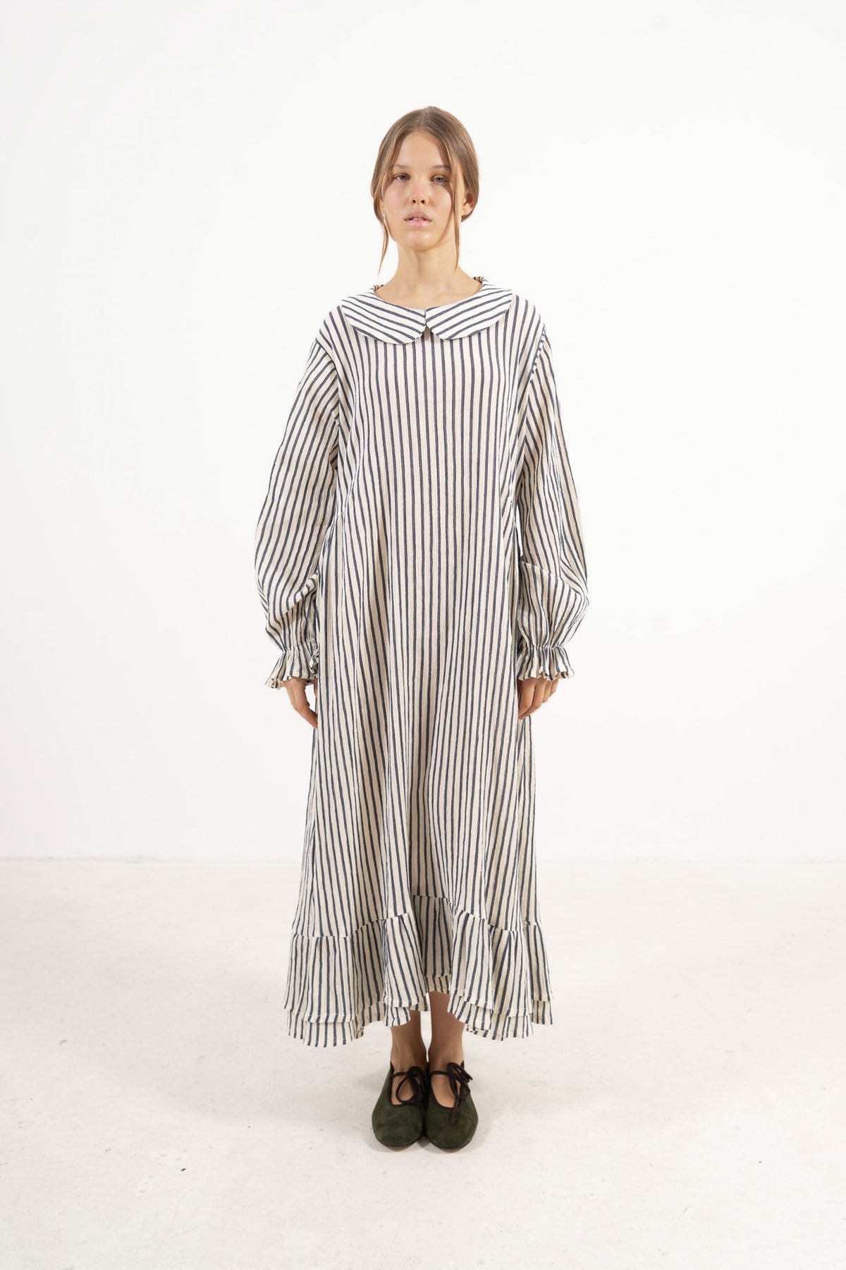 Front view studio portrait featuring a model in the Sillage Dress by MOCHA, capturing its effortless elegance and soft world of lightness.