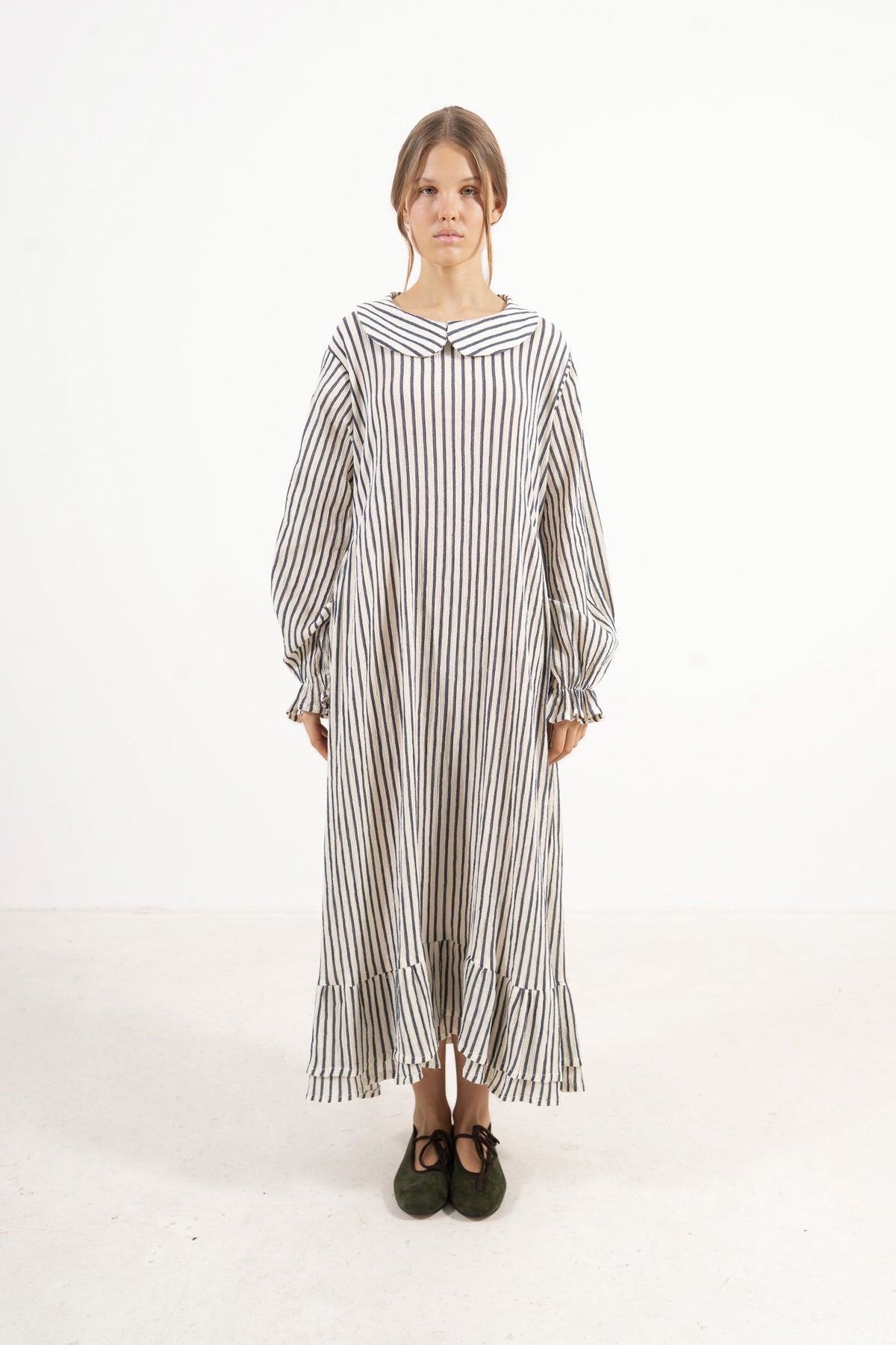 Front view studio portrait featuring a model in the Sillage Dress by MOCHA, capturing its effortless elegance and soft world of lightness.